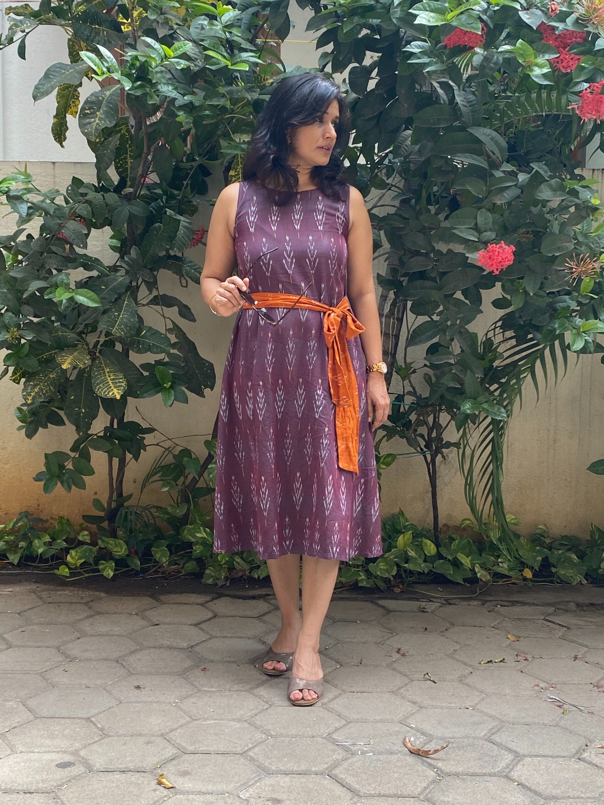 Purple ikkat dress with an orange belt