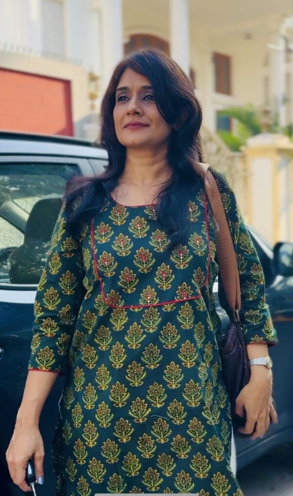 Woman wearing green ajrakh kurta for office