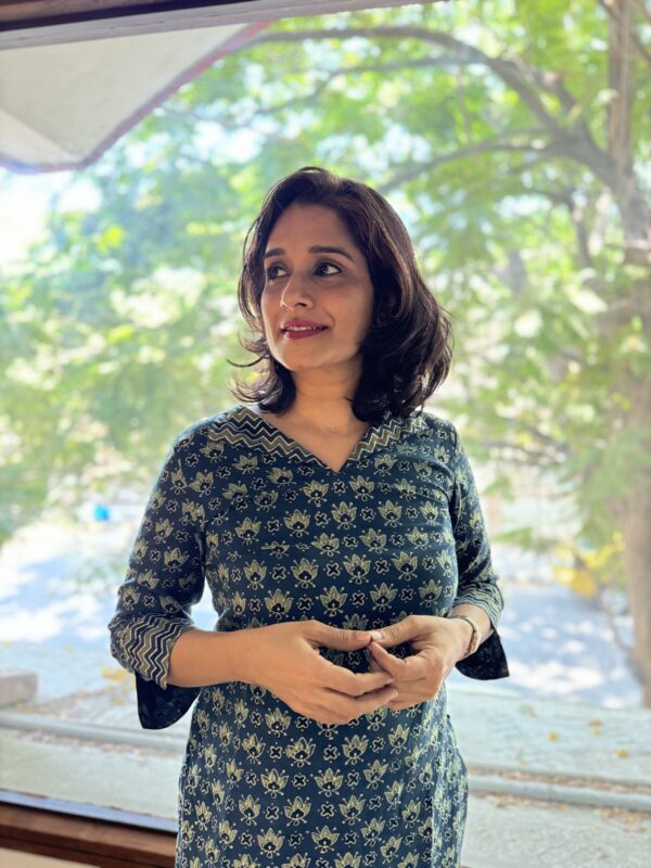 Girl wearing Ajrakh kurta set for work