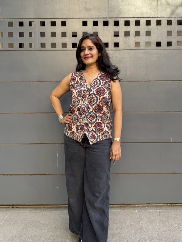 Ajrakh waist coat in white prints paired with black jeans