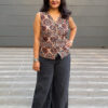 Ajrakh waist coat in white prints paired with black jeans